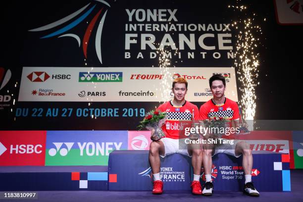 Marcus Fernaldi Gideon and Kevin Sanjaya Sukamuljo of Indonesia pose with their trophies after the Men's Double final match against Satwiksairaj...