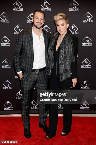Nic Kerdiles and Savannah Chrisley attend the grand opening of E3 Chophouse Nashville on November 20, 2019 in Nashville, Tennessee.
