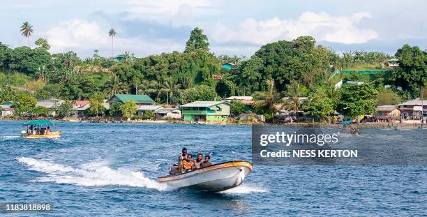 This photo taken on November 21, 2019 shows the bustling waterway in the capital Buka ahead of an historical independence vote. - The resource-rich...