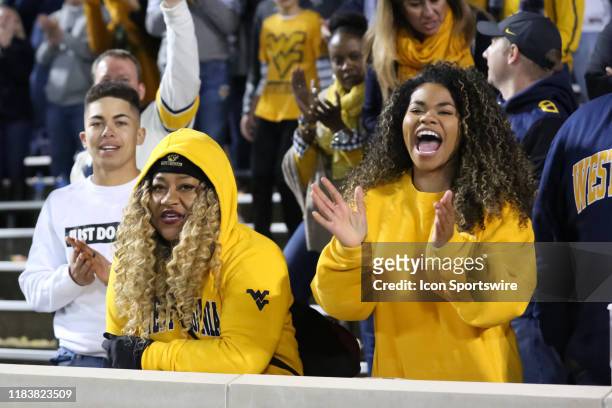 West Virginia Mountaineers fans cheer on their team in the fourth quarter of a Big 12 football game between the West Virginia Mountaineers and Kansas...