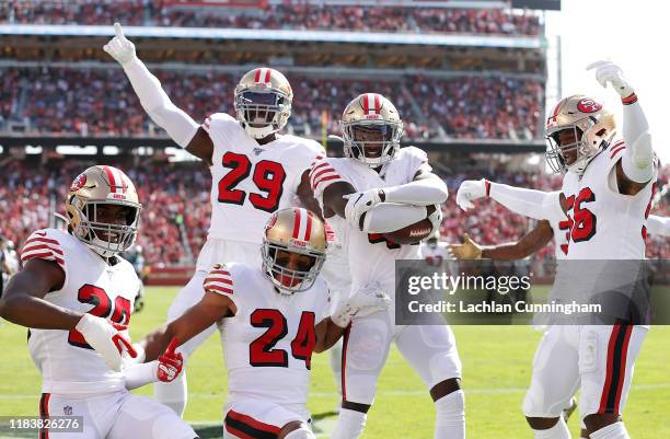 Emmanuel Moseley of the San Francisco 49ers and his defensive teammates celerabate an interception in the second quarter against the Carolina...