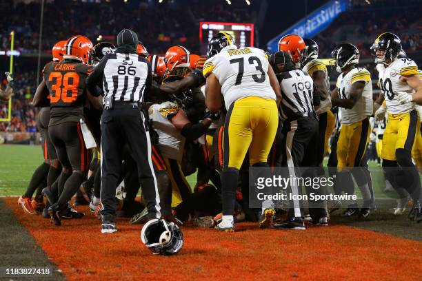 The Cleveland Browns and Pittsburgh Steelers benches clear after Cleveland Browns defensive end Myles Garrett hit Pittsburgh Steelers quarterback...