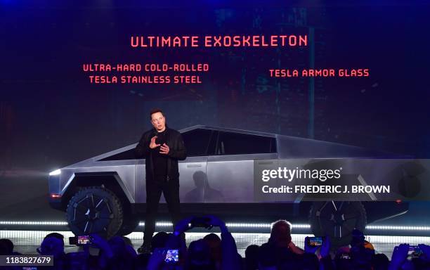 Tesla co-founder and CEO Elon Musk unveils the all-electric battery-powered Tesla's Cybertruck at Tesla Design Center in Hawthorne, California on...