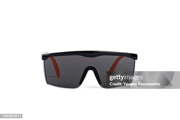 black safety glasses personal protective equipment on white background - sunglasses ストックフォトと画像