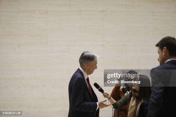 Philip Hammond, former U.K. Chancellor of the Exchequer, left, speaks to members of the media following a panel discussion at the Bloomberg New...