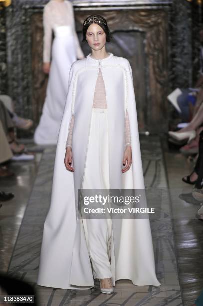 Model walks the runway during the Valentino Haute Couture Fall/Winter 2011-12 show as part of the Paris Haute Couture Fashion Week on July 06, 2011...