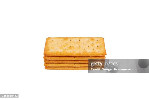 stack of delicious salty crackers isolated on white background - crackers stock pictures, royalty-free photos & images