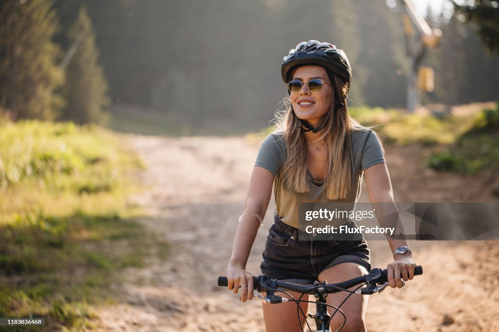Gorgeous woman riding a bike