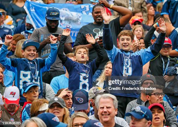 Fans of the Tennessee Titans cheer during the first half of the game against the Tampa Bay Buccaneers at Nissan Stadium on October 27, 2019 in...