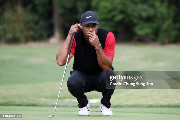 Tiger Woods of the United States lines up a putt on the 13th green during the final round of the Zozo Championship at Accordia Golf Narashino Country...