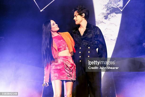 Kacey Musgraves and Harry Styles perform onstage at Bridgestone Arena on October 25, 2019 in Nashville, Tennessee.