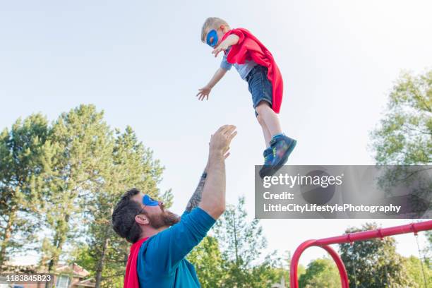 fun in the park - baby superhero stock pictures, royalty-free photos & images