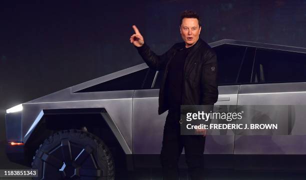 Tesla co-founder and CEO Elon Musk gestures while introducing the newly unveiled all-electric battery-powered Tesla Cybertruck at Tesla Design Center...