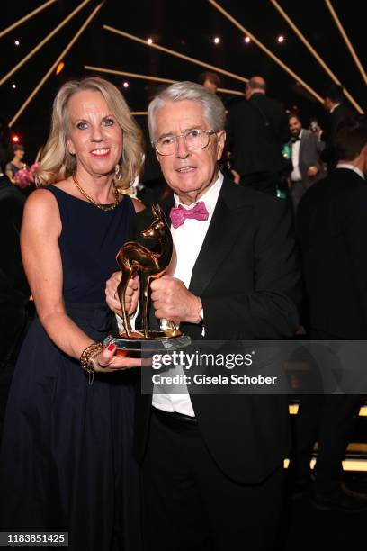 Frank Elstner and his wife Britta Gessler with award during the 71st Bambi Awards final applause at Festspielhaus Baden-Baden on November 21, 2019 in...