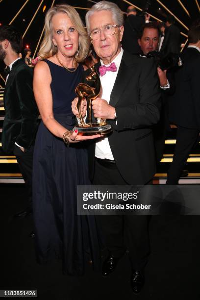 Frank Elstner and his wife Britta Gessler with award during the 71st Bambi Awards final applause at Festspielhaus Baden-Baden on November 21, 2019 in...