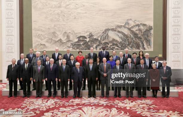Chinese President Xi Jinping and Vice Premier Liu He attend a group photo event with former U.S. Secretary of State Henry Kissinger , former U.S....