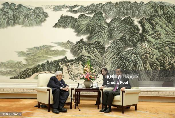 Chinese Foreign Minister Wang Yi meets former U.S. Secretary of State Henry Kissinger at the Great Hall of the People in Beijing, China November 22,...