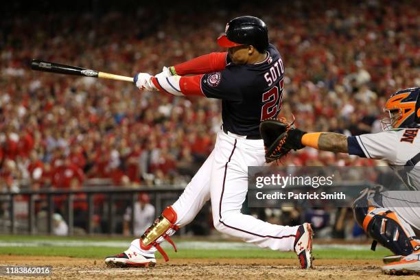 Juan Soto of the Washington Nationals hits a solo home run against the Houston Astros during the seventh inning in Game Five of the 2019 World Series...