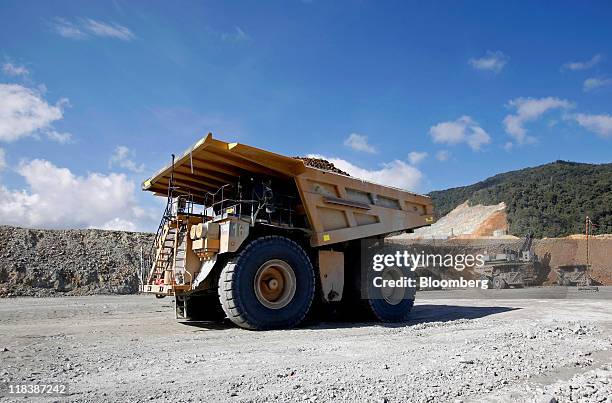 Haul trucks work at the Batu Hijau copper and gold mine operated by PT Newmont Nusa Tenggara in Sumbawa, West Nusa Tenggara province, Indonesia, on...