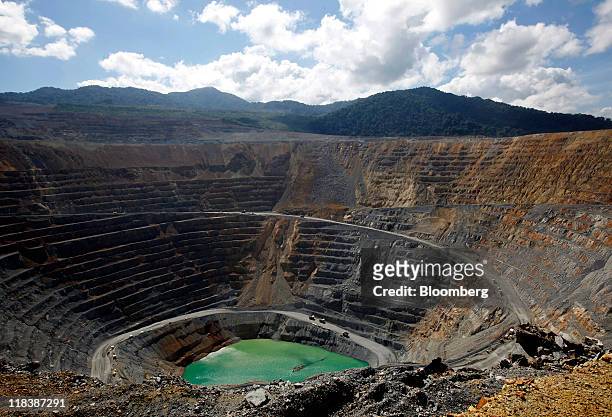 An open pit sits in the Batu Hijau copper and gold mine operated by PT Newmont Nusa Tenggara in Sumbawa, West Nusa Tenggara province, Indonesia, on...