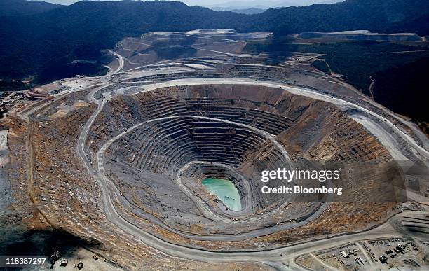 An aerial view shows an open pit at the Batu Hijau copper and gold mine operated by PT Newmont Nusa Tenggara in Sumbawa, West Nusa Tenggara province,...