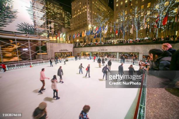 People as seen ice skating in Manhattan, New York City NY at the Rockefeller Center rink in front of the Christmas Tree 2019 at the 5th Ave between...
