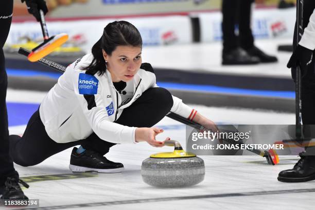 Switzerland's Esther Neuenschwander is in action during the Women's semifinal between Scotland and Switzerland at the European Curling Championships...