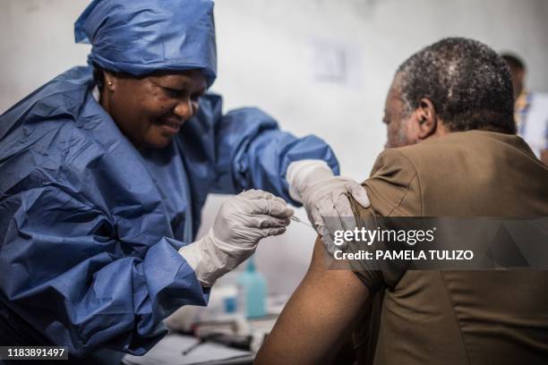 Doctor Jean-Jacques Muyembe Tamfun is getting inoculated with an Ebola vaccine on November 22, 2019 in Goma.