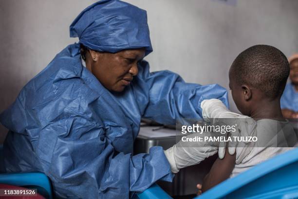 Girl is getting inoculated with an Ebola vaccine on November 22, 2019 in Goma.