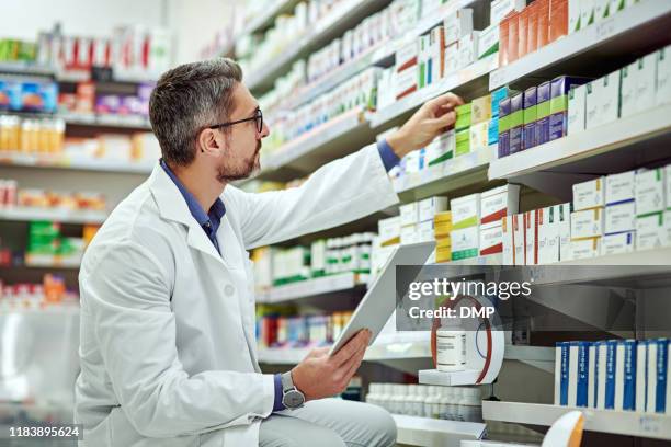 managing pharmaceutical matters the digital way - doctor reaching stock pictures, royalty-free photos & images