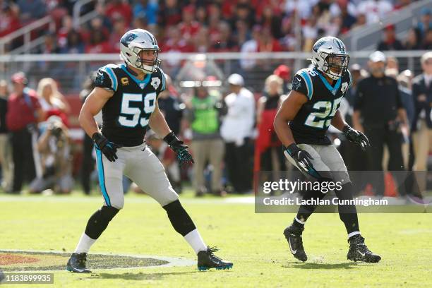 Defenders Luke Kuechly and Eric Reid of the Carolina Panthers line up against the San Francisco 49ers in the first half at Levi's Stadium on October...