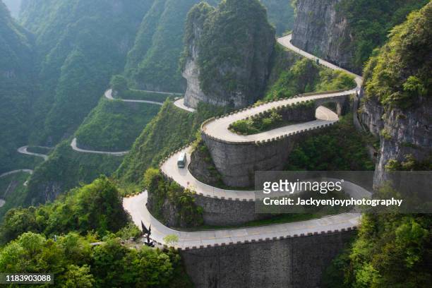 winding road, tianmen mountain, zhangjiajie, hunan, china - truck turning stock pictures, royalty-free photos & images