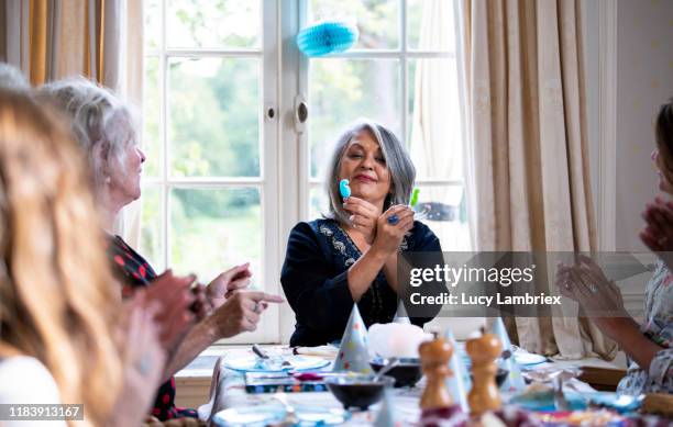 mixed group of women having a vegan birthday lunch party - woman birthday stock pictures, royalty-free photos & images