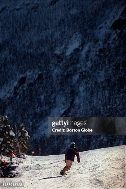 Snowboard designer Jake Burton rides one of his boards in Stowe, VT on Dec. 11, 1997.