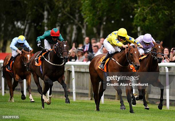 Eddie Ahern riding Frederick Engels win the TNT July Stakes at Newmarket racecourse on July 07, 2011 in Newmarket, England.