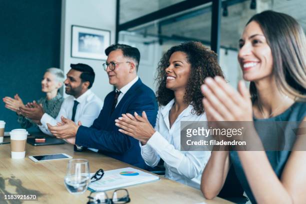 business presentation - applauding stock pictures, royalty-free photos & images