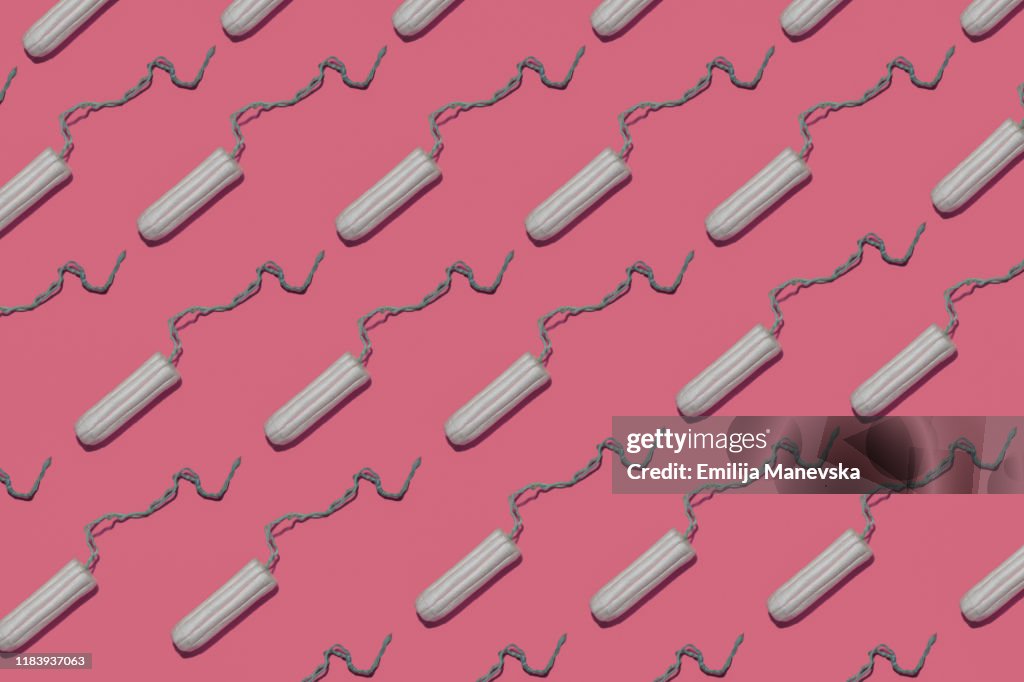 Tampons on pink background