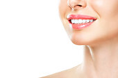 Perfect healthy teeth smile of a young woman. Teeth whitening. Dental clinic patient. Image symbolizes oral care dentistry, stomatology. Isolate en white backround