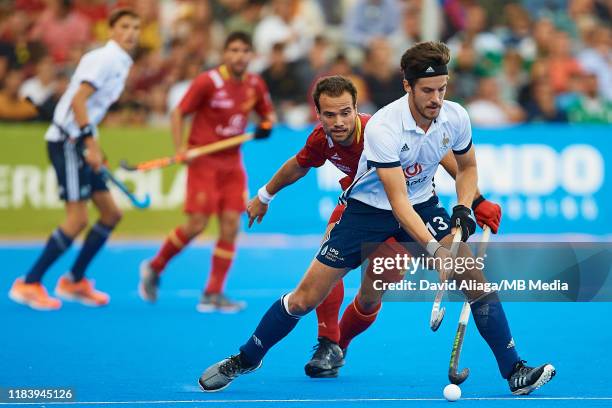 Nicolas Dumont of France competes for the ball with Alvaro Iglesias of Spain during the FIH Hockey Olympic Qualifiers game between Spain and France...