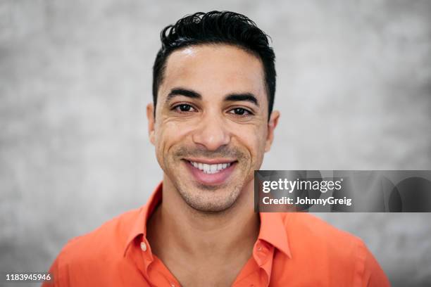 headshot portrait of happy mid adult hispanic businessman - black hair stock pictures, royalty-free photos & images