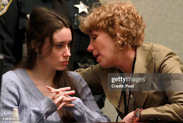 Casey Anthony talks with her attorney Dorothy Clay Sims during her sentencing hearing on charges of lying to a law enforcement officer at the Orange...