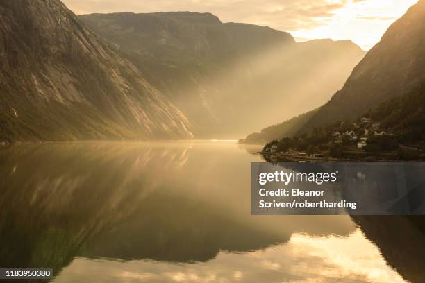 shafts of light enter misty, beautiful eidfjord, fjord reflections, hardangerfjord, norwegian western fjords, norway, scandinavia, europe - hardangerfjord ストックフォトと画像