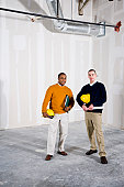 Multi-ethnic men in office space ready for buildout