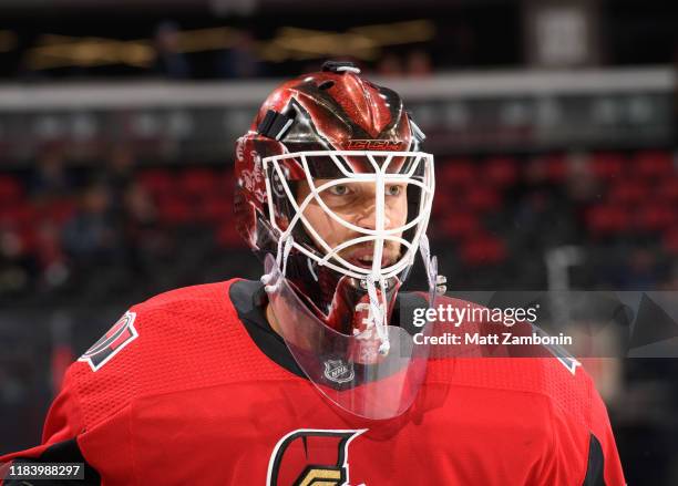 Anders Nilsson of the Ottawa Senators looks on during warm up prior to a game against the New York Islanders at Canadian Tire Centre on October 25,...