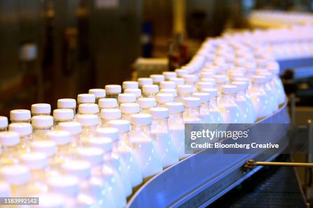 milk in plastic bottles - dairy product stock photos et images de collection