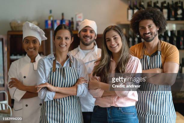 business owner at a restaurant with her staff - chef team stock pictures, royalty-free photos & images