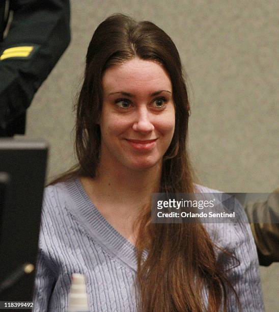 Casey Anthony smiles as her attorney Jose Baez arrives in court before the start of her sentencing hearing at the Orange County Courthouse in...
