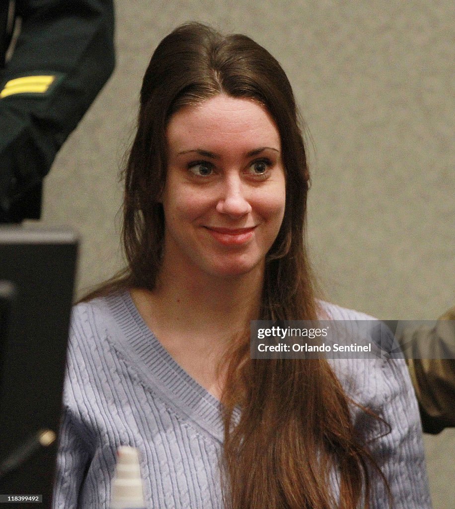 Casey Anthony smiles as her attorney Jose Baez arrives in court... News