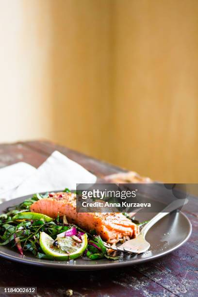 grilled salmon or trout fish fillet served with vegetables, selective focus - lachssteak stock-fotos und bilder