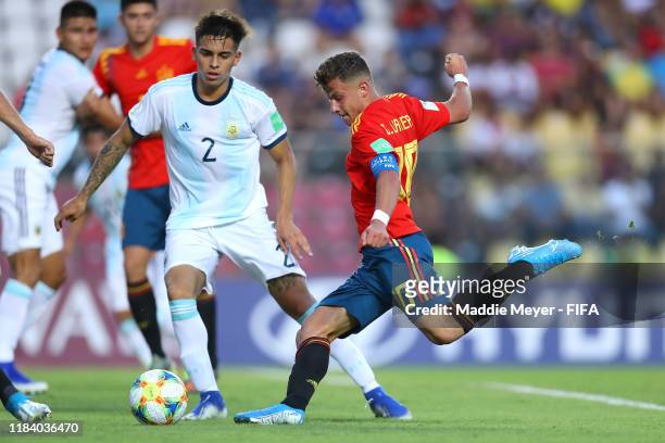 German Valera of Spain takes a shot against Alexis Flores of Argentina during the FIFA U-17 World Cup Brazil 2019 group E match between Spain and...
